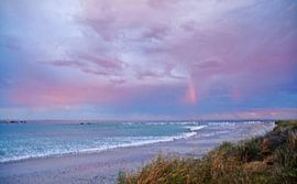rainy sunrise over the beach and sea by Werner Lehmann
