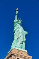 The Statue of Liberty in New York City USA daylight close up low angle view  with blue sky  in backg