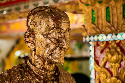 Golden buddha statue in a Thai temple