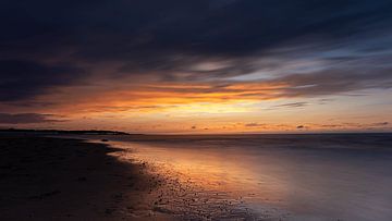 Moody sunset at the beach by Josephine Huibregtse