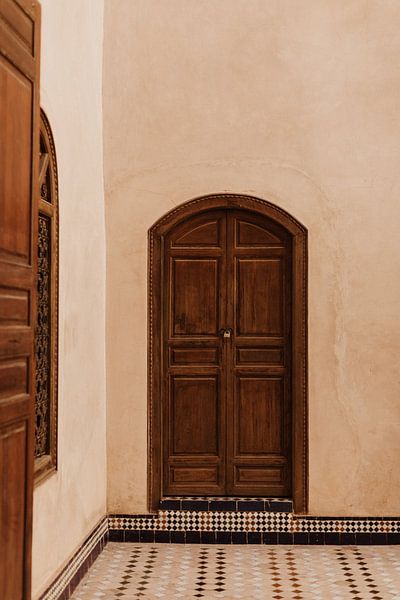 Vintage brown door in the Bahia Palace in Marrekech, Morocco by Joke van Veen
