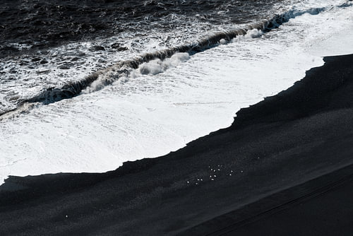 Waves on black beach