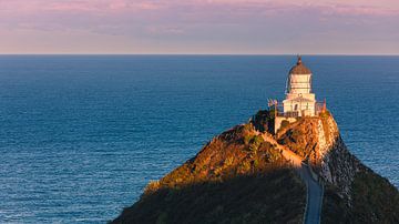 Sunset at the lighthouse near Nugget Point, New Zealand
