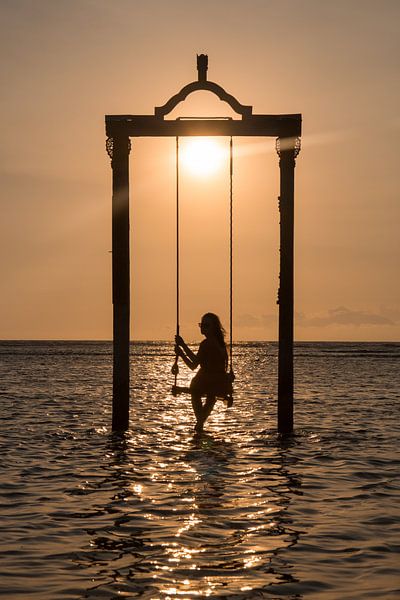Girl on swing in Balinese sunset by Sofie Bogaert