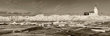 Netherlands, Marken, Creeping ice in front of lighthouse.
