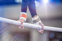 Symbolic image of apparatus gymnastics: close-up of a gymnast on the step beam