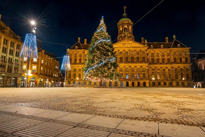 Christmas on the Dam Square in Amsterdam by night by Eye on You