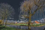 Zicht op Dronrijp in Friesland door jong ontluikende bomen in het voorjaar par Harrie Muis Aperçu