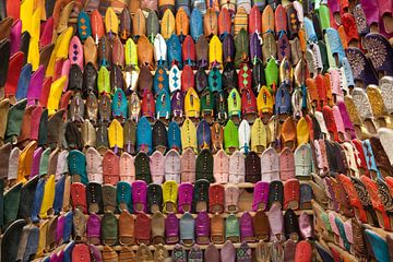Traditional Moroccan slippers for sale in the souk by Frans Rombout