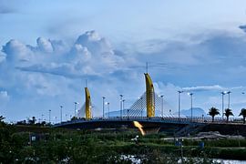 Suspension bridge and dramatic sky in Hoi An by Frank Photos