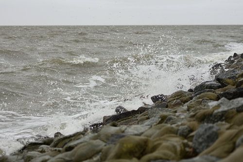 Waves beat against the dike