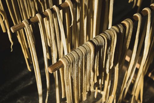 Sunlit Homemade Pasta Hanging to Dry