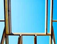 Room with airy view through skylight trusses