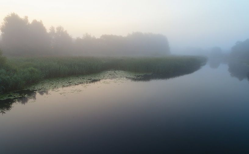 Calm lake in the early fogy morning by Yevgen Belich