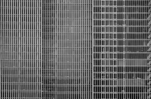 The Geometric Façade of De Rotterdam in Black and White