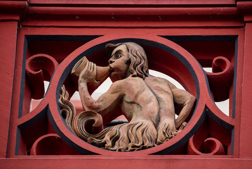Ballustrade with sculpture on the roof of the Basel Town Hall in Switzerland by Joost Adriaanse