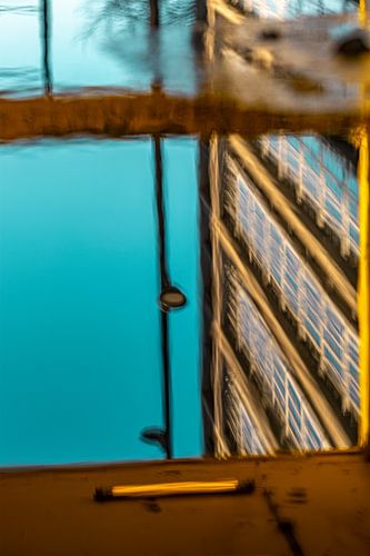 Urban scene reflection yellow and blue