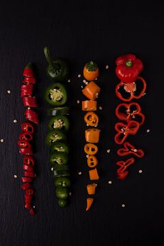 vier gekleurde pepers van Anita Visschers