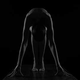 Artistic nude low-key symmetry model in black and white by Arjan Groot