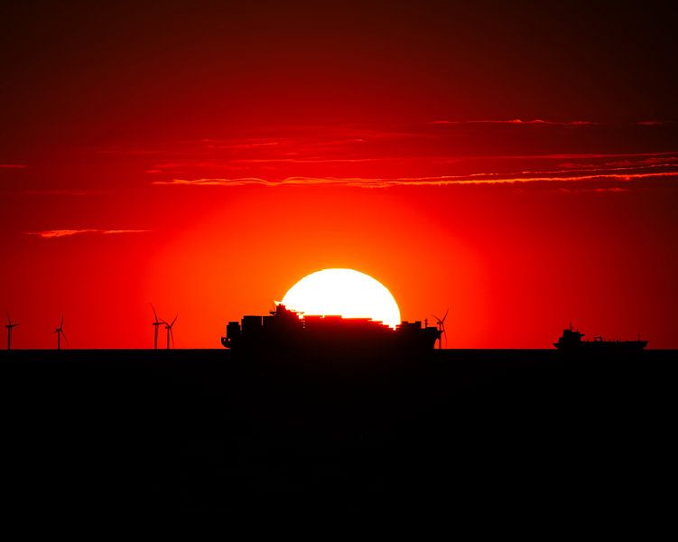 Sunset behind a Conatiner ship by Patrick Schwarzbach