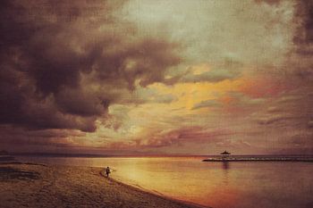 Dramatic sunset on the beach with a lonely person - Bali