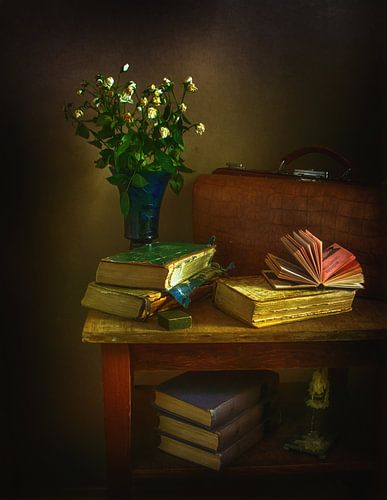 Still life with books and flowers. Stylized photograph.