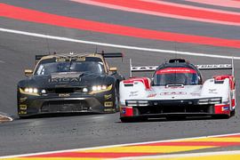 Porsche hypercar and Ford mustang GT3 in the eau Rouge bend at spa francorchamps by Arthur Bruinen