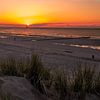 Zonsondergang op het strand bij Cadzand. van Wouter Van der Zwan