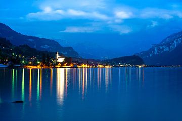 View over the lake of Brienz to Niederried near Interlaken at blue hour with by Leo Schindzielorz