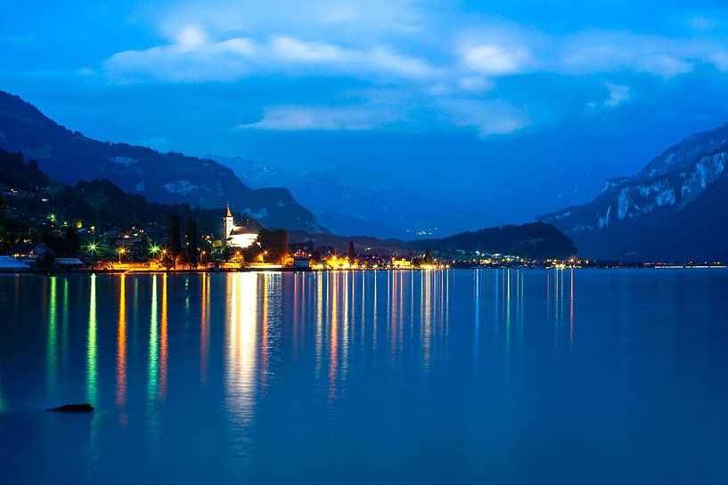 View over the lake of Brienz to Niederried near Interlaken at blue hour with by Leo Schindzielorz