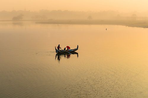 Gondola rides at sunrise along the U BAIN Mandelay bridge in Myanmar. The bridge is the longest teak by Wout Kok