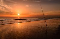 Vissen tijdens zonsondergang