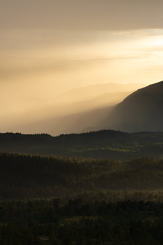 Golden light beams over the mountains