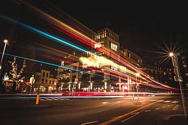 Busy intersection with light beams by Jesper Stegers