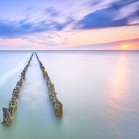 Breakwater in the IJsselmeer at sunset, Hindeloopen, Friesland by Jenco van Zalk