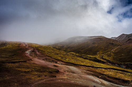 Path leading to moody mountains
