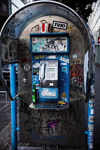 Old-fashioned dirty phone booth in Berlin