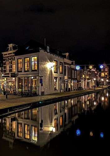Maassluis spring street city center night authentic old town reflected in the water