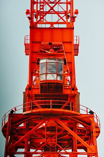 Red Carola Crane in Bilbao against a minimalist backdrop by Bas Potman