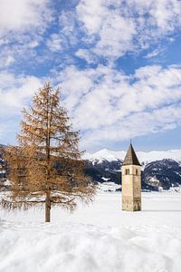 Resia Lake with the sunken church tower in winter