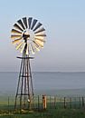 Windmill water pump at sunrise by Werner Lehmann thumbnail