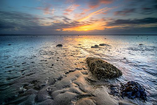 Wadden Sea with mudflats and sunset