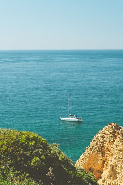 Sailing yacht off the Algarve coast by Swittshots