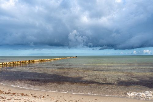 Baltic Sea beach with dramatic clouds and sea in Fischland Zings