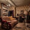 Living room in dilapidated house by Inge van den Brande