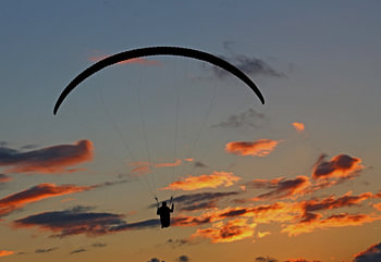 Paraglider by sunset