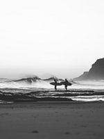 Surfers On The Beach In Black And White