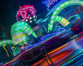 A ride on the river – a carousel spinning in the neon lights of the night by Mixed media vector arts