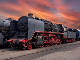 Steam locomotive in surrealistic landscape