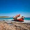 Colourful shipwreck on Greek coast by Michel Seelen